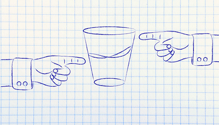 A hand-drawn image on graph paper depicting three pointing fingers from different angles, each aiming towards a centrally located, simple sketch of a cup.