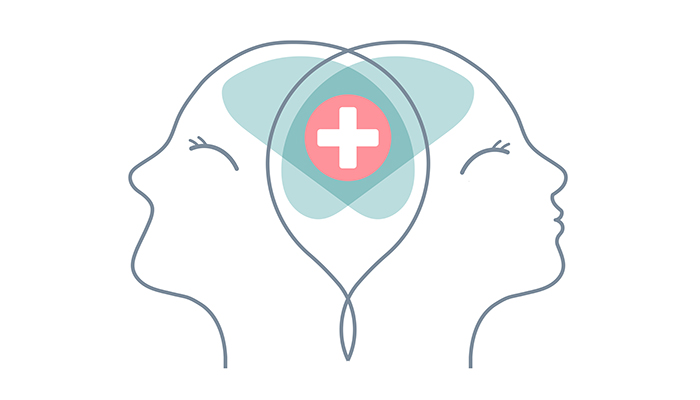 Illustration of two symmetrical profile outlines of heads facing away from each other, connected by a shared brain area, which contains a medical cross in a thought bubble.