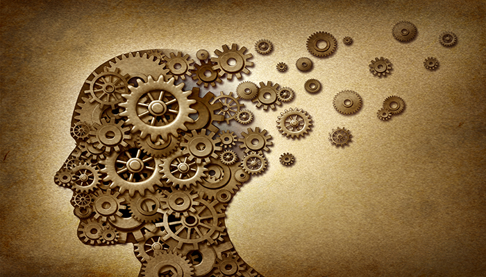 Illustration of a human head profile made from interlocking metal gears and cogs on a textured, sepia-toned background, suggesting a conceptual theme of complex thinking or brain function.