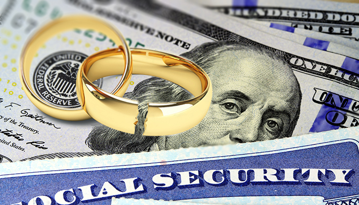 Two gold wedding rings on top of u.s. currency and a social security card, symbolizing the financial aspects of marriage.